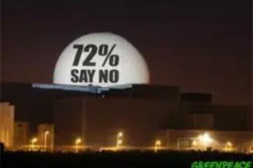 72% of the British public say no to nuclear power and yes to wind. Greenpeace projects poll result onto Sizewell nuclear plant in Suffolk, UK ©Greenpeace
